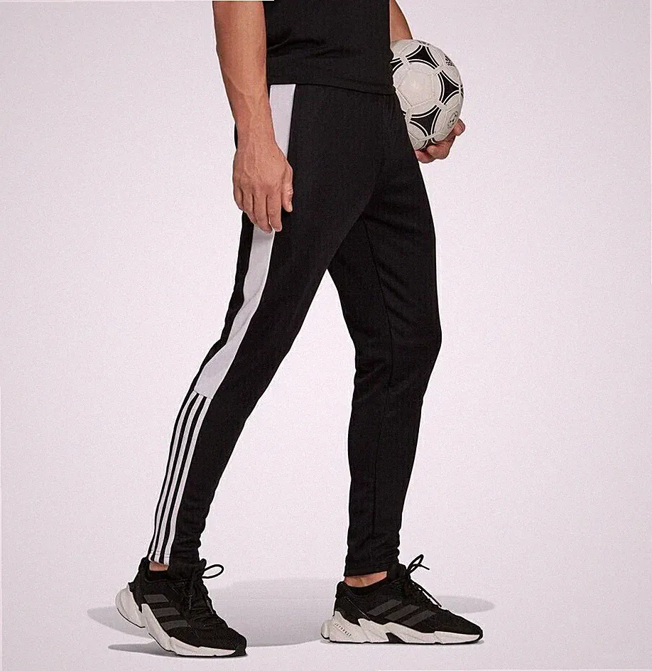 Adidas Training Jogging Hose Tiro Essentials in Schwarz-Weiß/ Schwarz-Orange