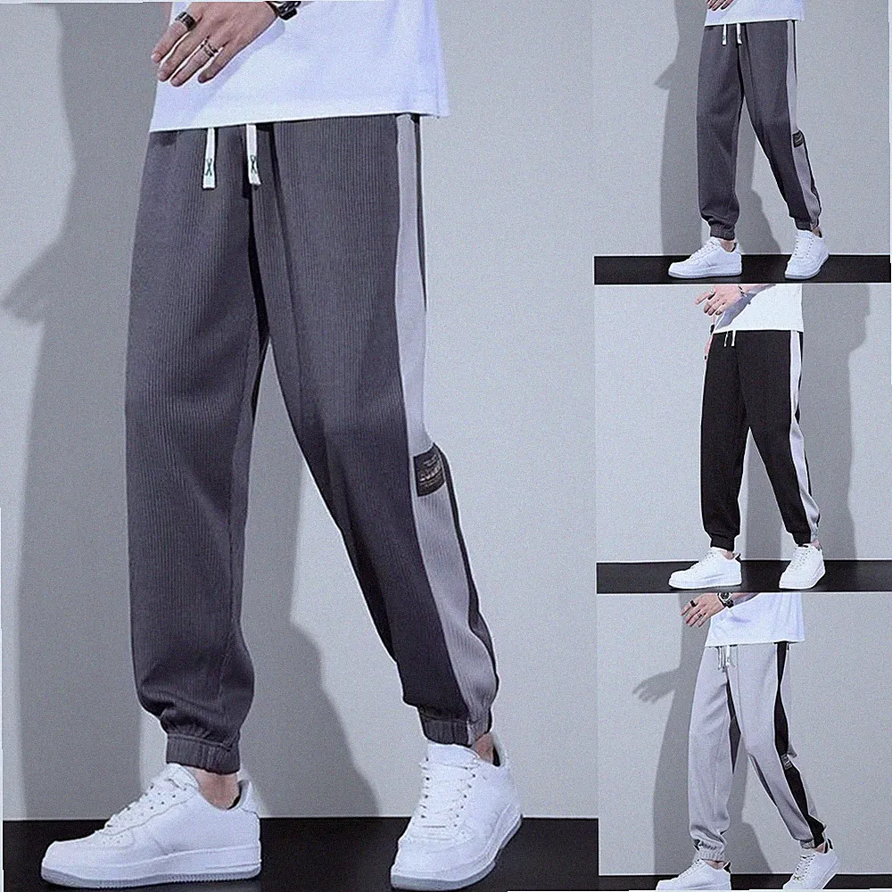 Durchgehende Herren Slim Fit Jogginghose mit Bündchen am Saum Patchwork Design