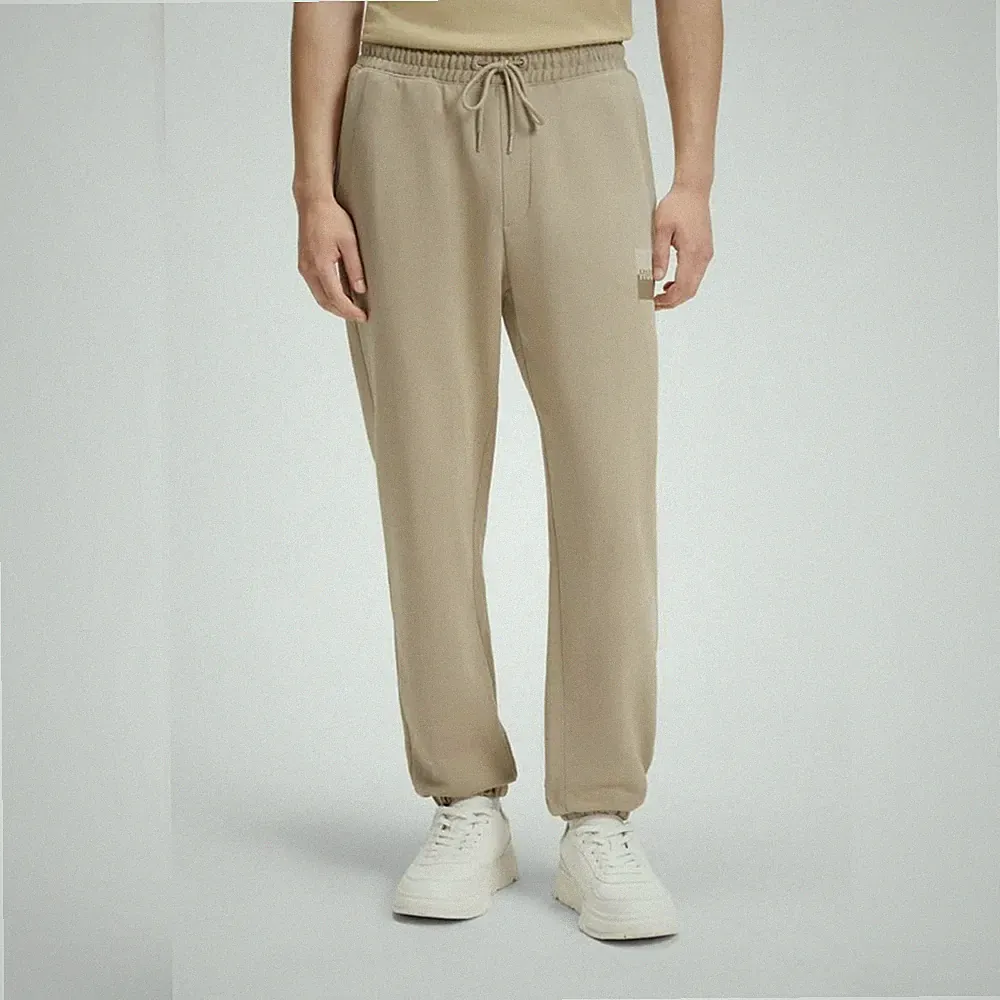HUGO BOSS Jogginghose (EU: M) aus Baumwoll-Terry mit Split-Logo, Beige