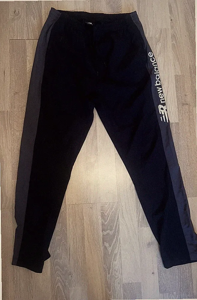 New Balance Herren Trainingshose Schwarz M Polyester gerades Bein, elast. Bund