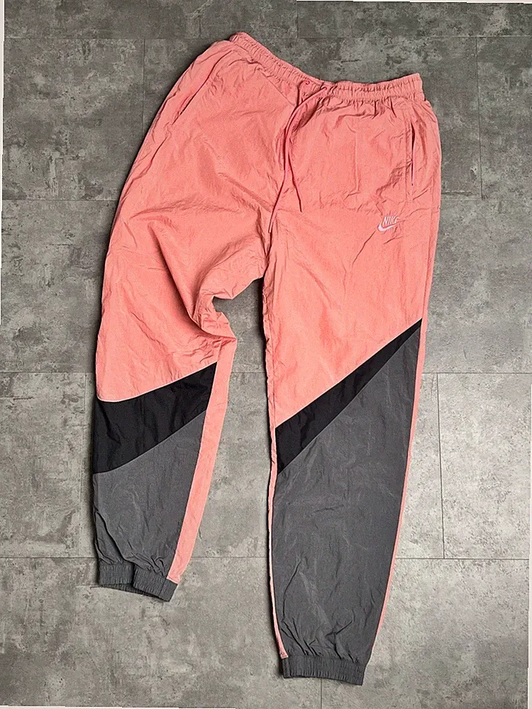Nike Herren Windbreaker Track Pants Pink Retro, Größe M
