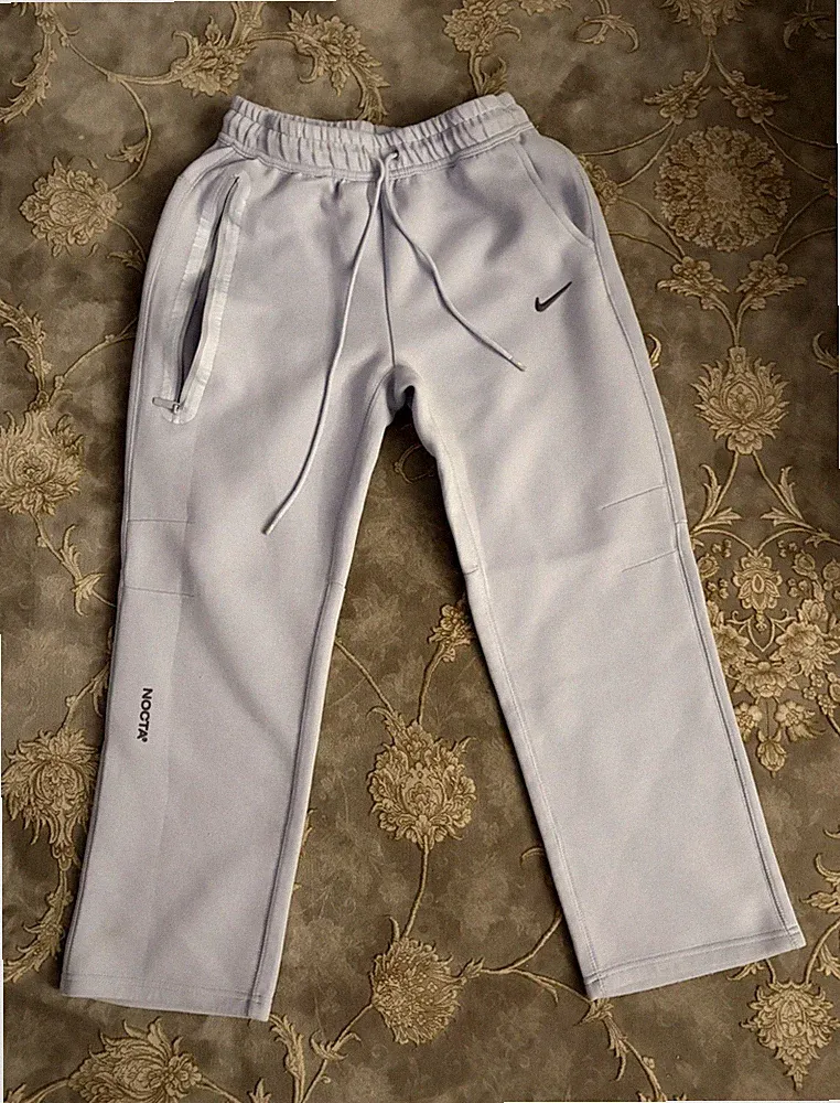 Nike NOCTA Herren Jogginghose Grau Gr. P mit Schnürung und Taschen