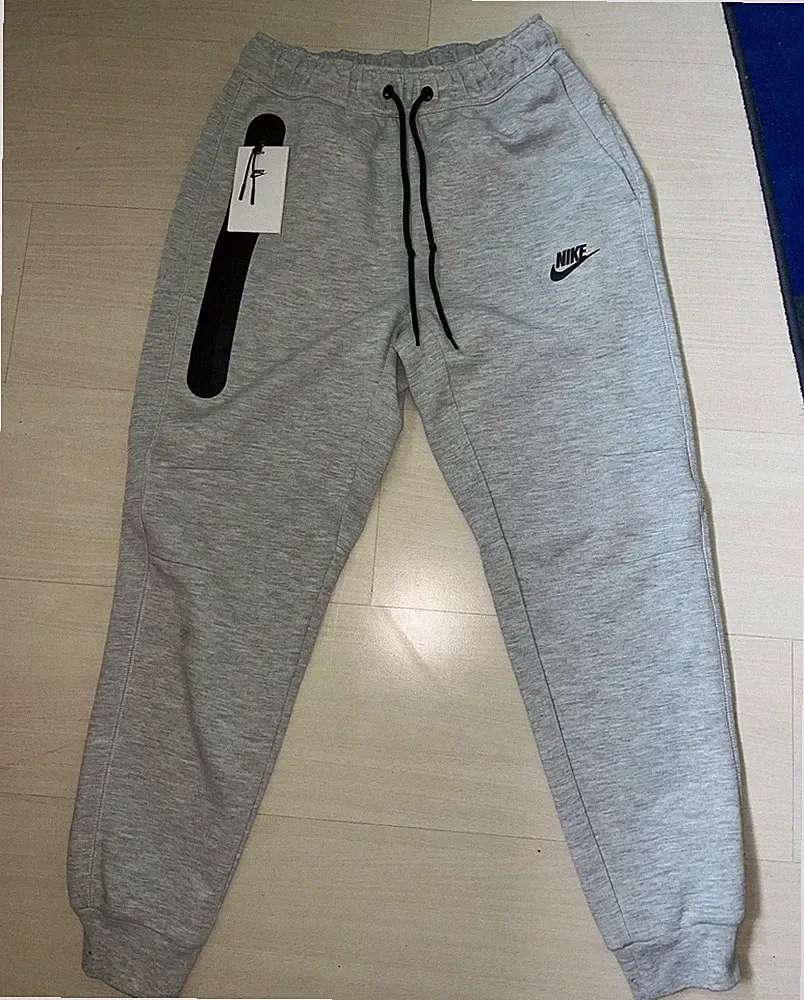 Nike Tech Jogginghose Grau Gr. M Baumwollmischung Kordelzug Taschen tapered