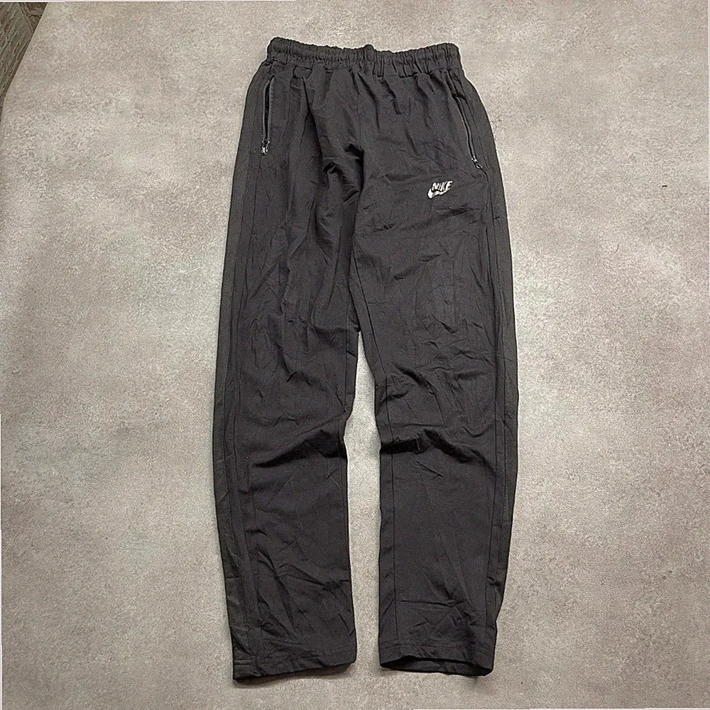 Nike Trainingshose Herren Medium Dri-FIT Loose Fit Sportswear Jogginghose,...