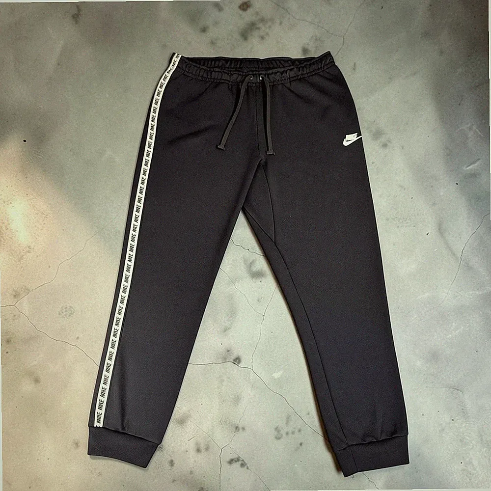Nike Trainingshose Jogginghose Gr. L Schwarz Taped Logo Stripes Herren Pants