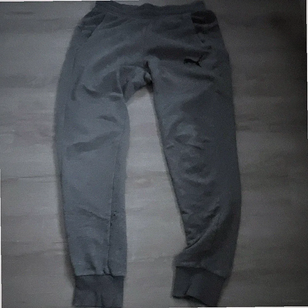 PUMA Herren Jogginghose Grau L Polyester Tapered elastischer Bund Logo