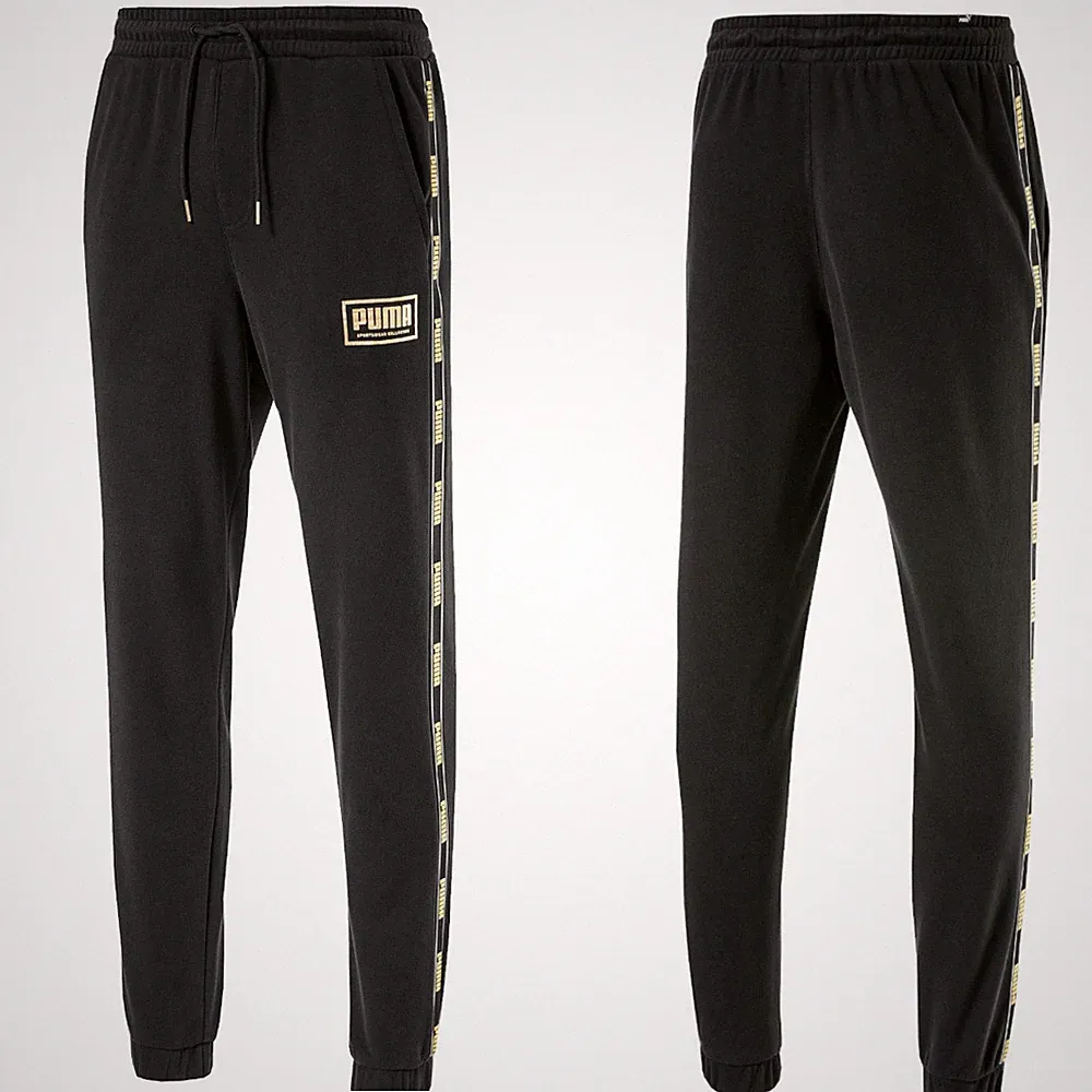 Puma Herren Sweathose Trainingshose Gr.M Holiday Fleece Jogginghose schwarz-gold