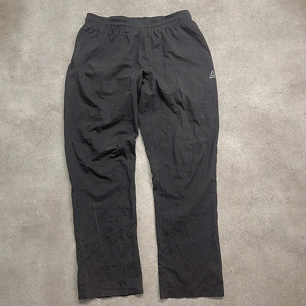 Reebok Trainingshose Herren Large Nylon Straight Fit Sport Jogginghose, schwarz