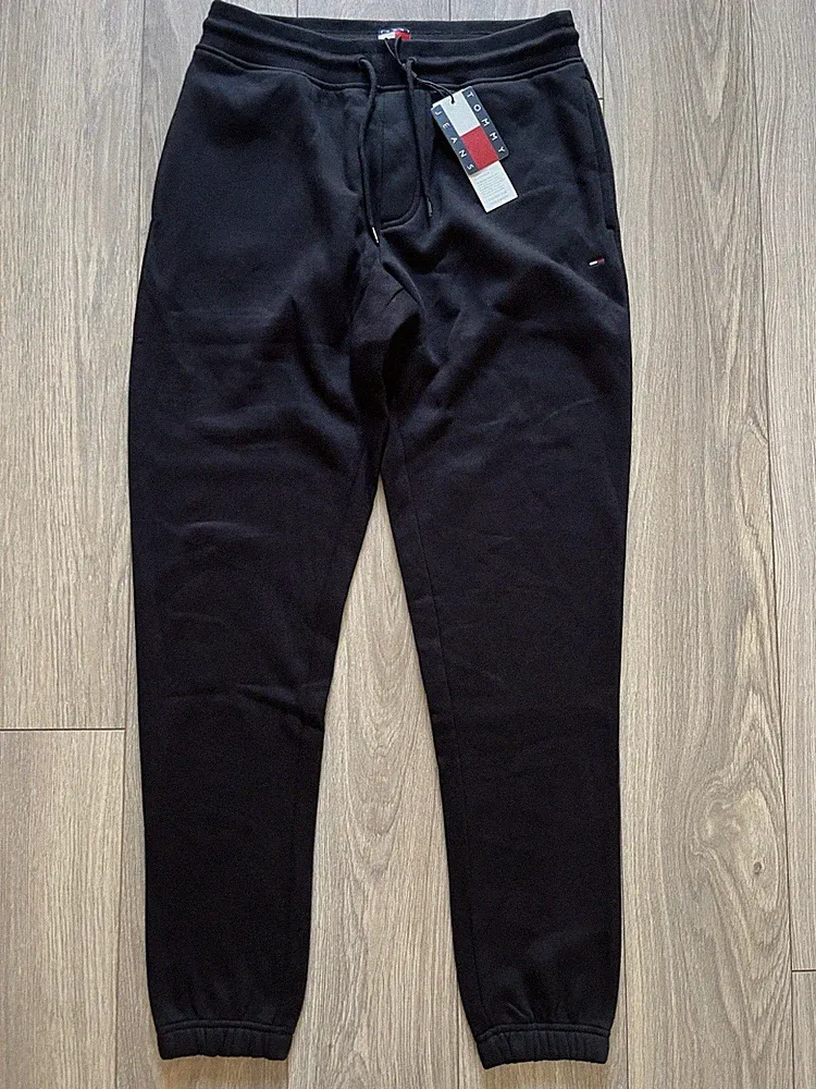 Tommy Jeans TJ Flagge schmale Passform geschlossener Saum Fleece Jogginghose Medium schwarz £50 UVP NEU MIT ETIKETT